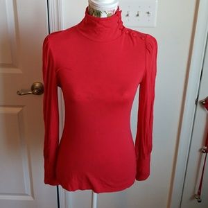 INC. Red turtleneck